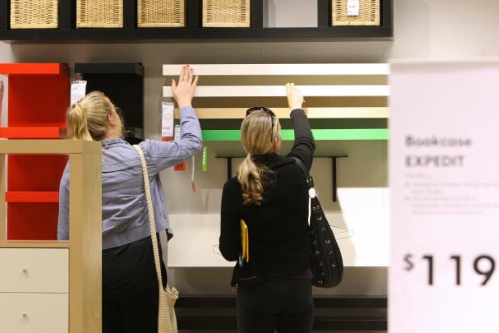 Customers inspect furniture in Ikea Group's new store in the suburb of Tempe in Sydney, Australia, on Thursday, Nov. 3, 2011. Ikea opened their largest store in the Southern Hemisphere on Nov. 3. Bloomberg/Sergio Dionisio