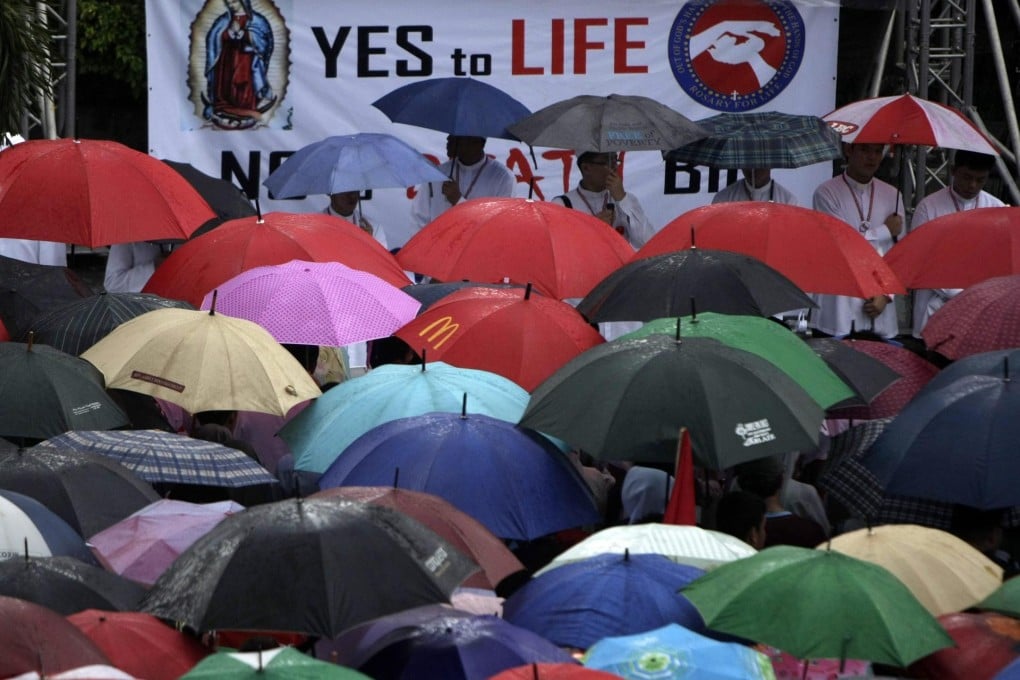 Catholic clergy lead a protest against the Reproductive Health bill in Metro Manila. Surveys show there is little public support for the church's opposition to the bill.Photo: EPA