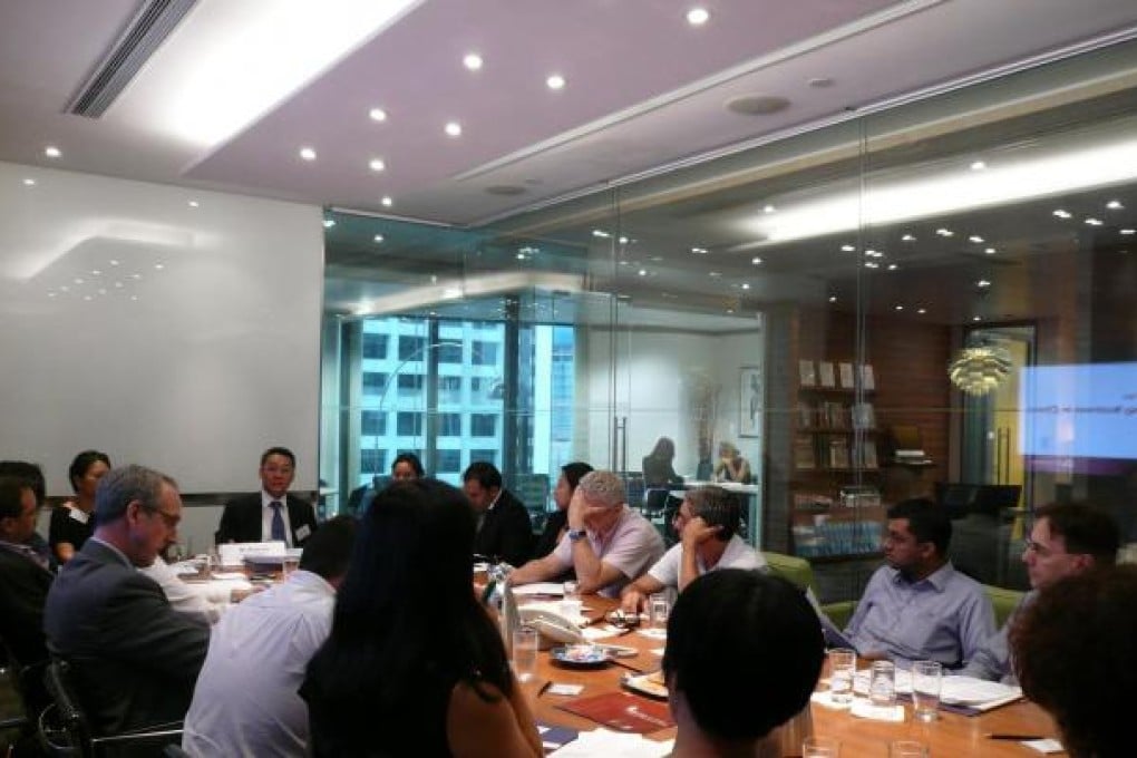 Delegates attend a seminar on the requirements and possible problems in setting up a company in China.