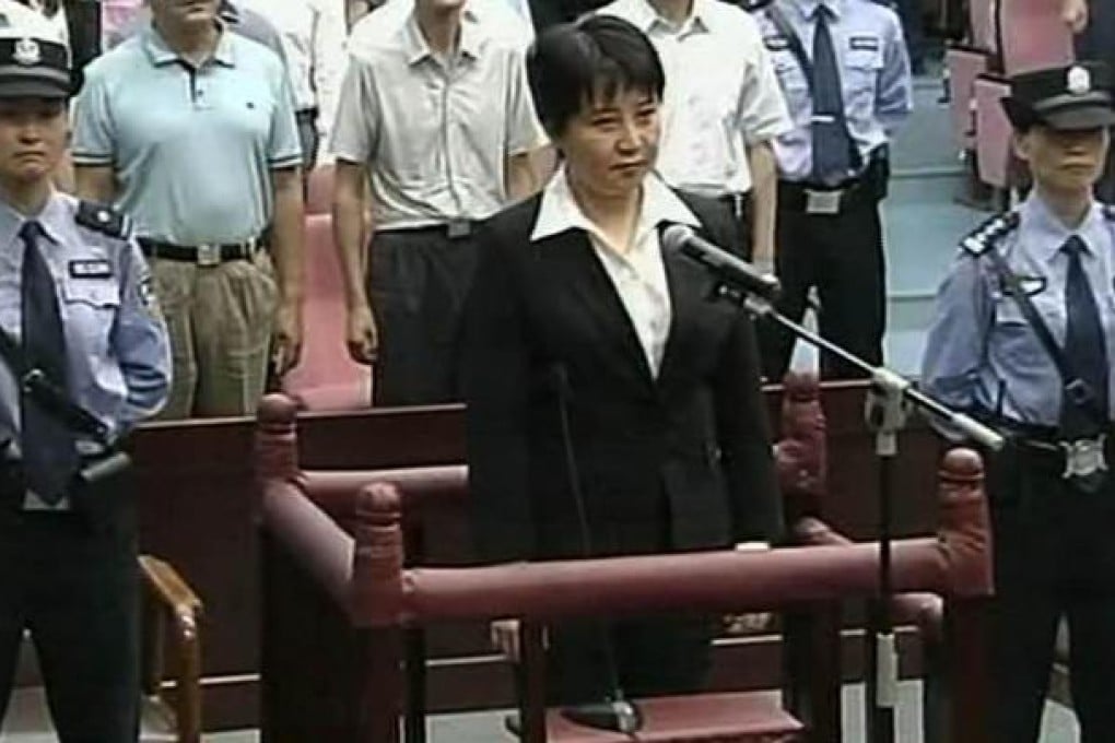 Gu Kailai listens in court as she is handed a suspended death sentence for the murder of British businessman Neil Heywood. Photo: AFP
