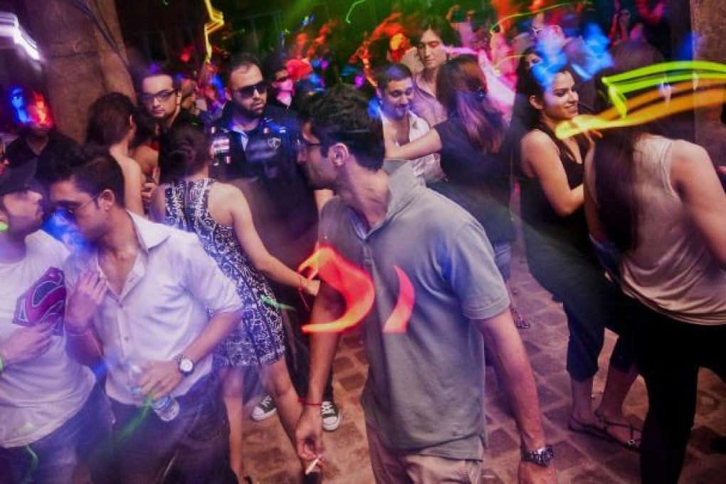 Men and women dance at Centrifuge, an underground rave held on the outskirts of Islamabad to avoid prying eyes. Photo: Reuters