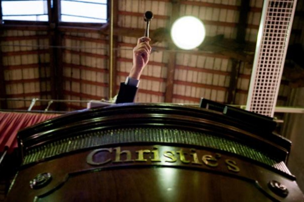 The hammer goes down at an auction in Burgundy. Photo: AFP