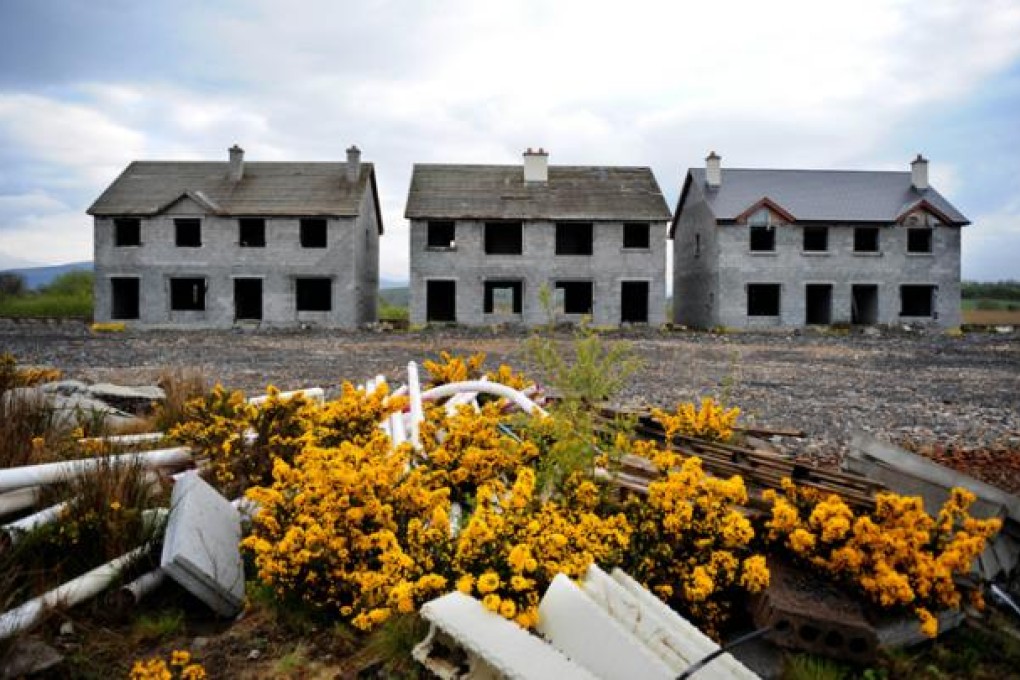 Unfinished homes sit abandoned at an estate in Keshcarrigan, County Leitrim, in Ireland - silent monuments to greed and unchecked bank lending during a boom. Photo: Bloomberg