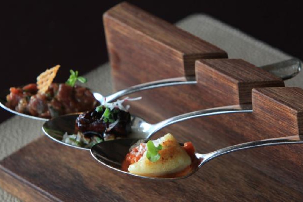 Spoons: seared gnocchi and tomato concasse, spicy chicken wing and beef tartare. Photo: Jonathan Wong