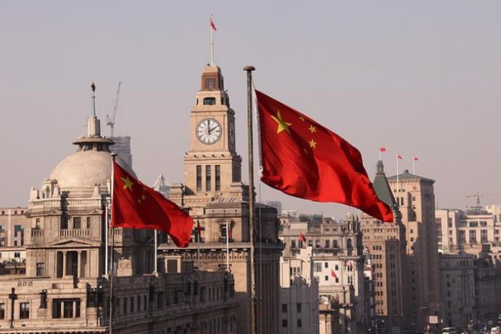 Chinese flags seen on the Bund, Shanghai's historic waterfront. Photo by George Chen