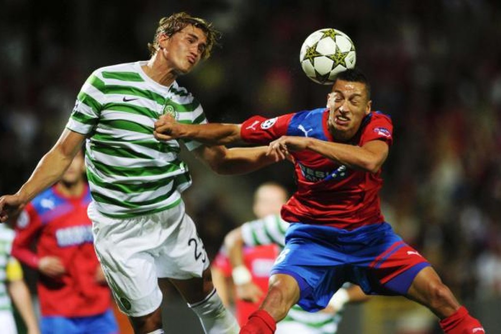 Celtic's Thomas Rogne leaps to challenge Helsinborg's Nikola Durdic as the Scottish champions get the upper hand. Photo: Reuters