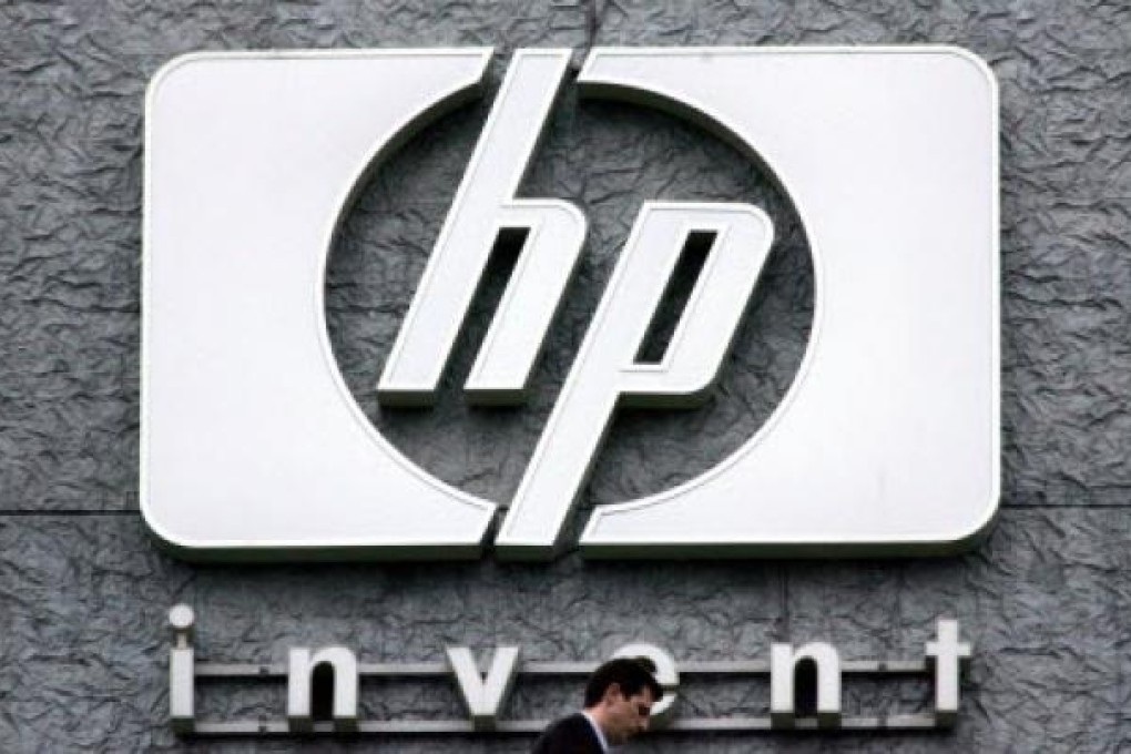 Tumbling PC sales, writedown push HP into quarterly loss