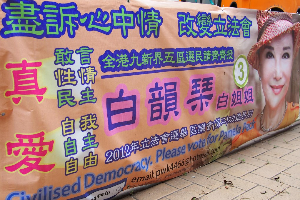 A banner in Pok Fu Lam displaying a "3" - Josephine Chan, a Democratic Party candidate, is to complain. Photo: Tony Cheung