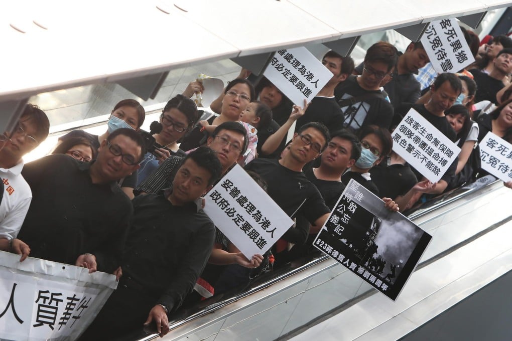 Survivors and relatives of victims of the 2010 Manila hostage saga gather at Admiralty to meet government officials. Photo: Sam Tsang