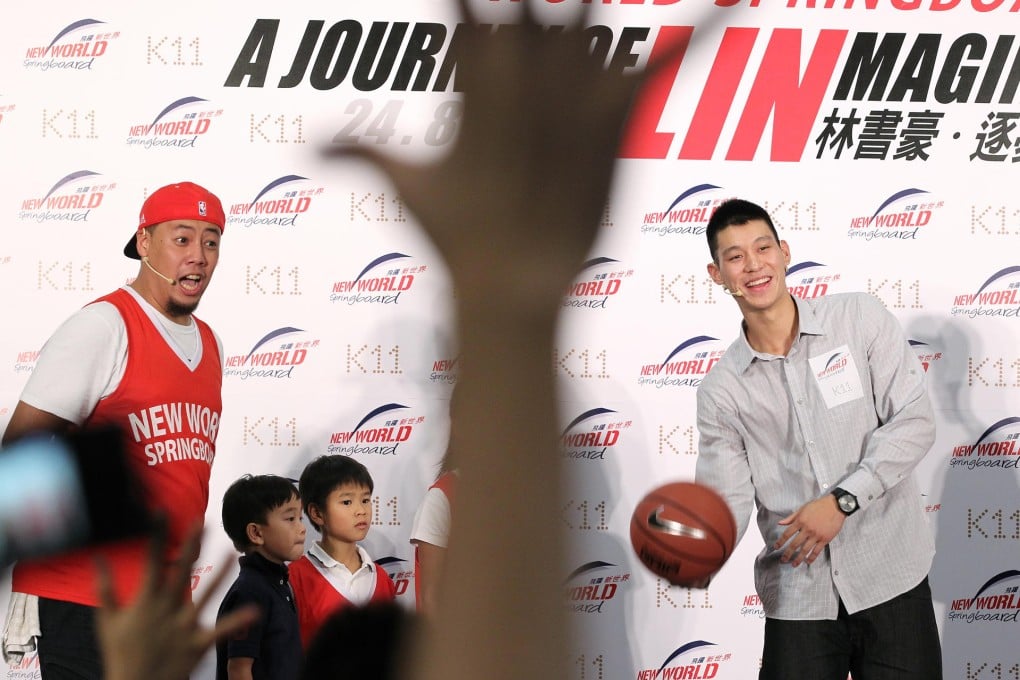 Basketball superstar Jeremy Lin (right) laughs and jokes with his young audience at the launch of the charity scheme. Photo: K.Y. Cheng