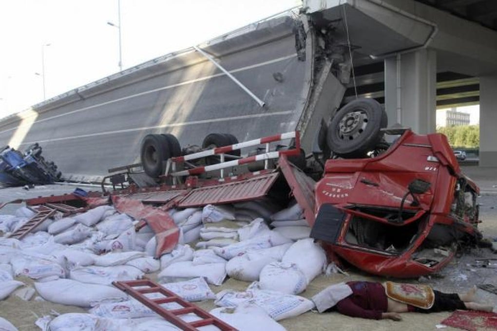 Four trucks loaded with construction materials were on the ramp. Two of the injured are in critical condition in hospital. Photo: Reuters
