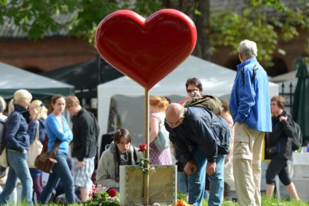 Norwegians gather at the Olav Dag Cathedral in Oslo to remember the victims of the attacks on 22 July, 2011, when 77 people died. Photo: EPA