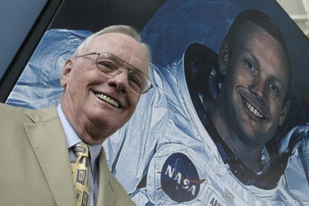Neil Armstrong, pictured in front of his photo during a visit to in Spain in 2005, commanded the Apollo 11 mission to the moon. Photo: AFP