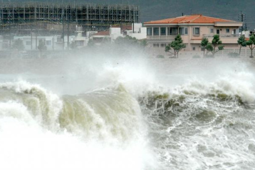 High waves pound the shore of Yonabarucho in Okinawa. More than 75,000 households lacked power on Monday after the powerful typhoon lashed the southern Japanese island. Photo: AP