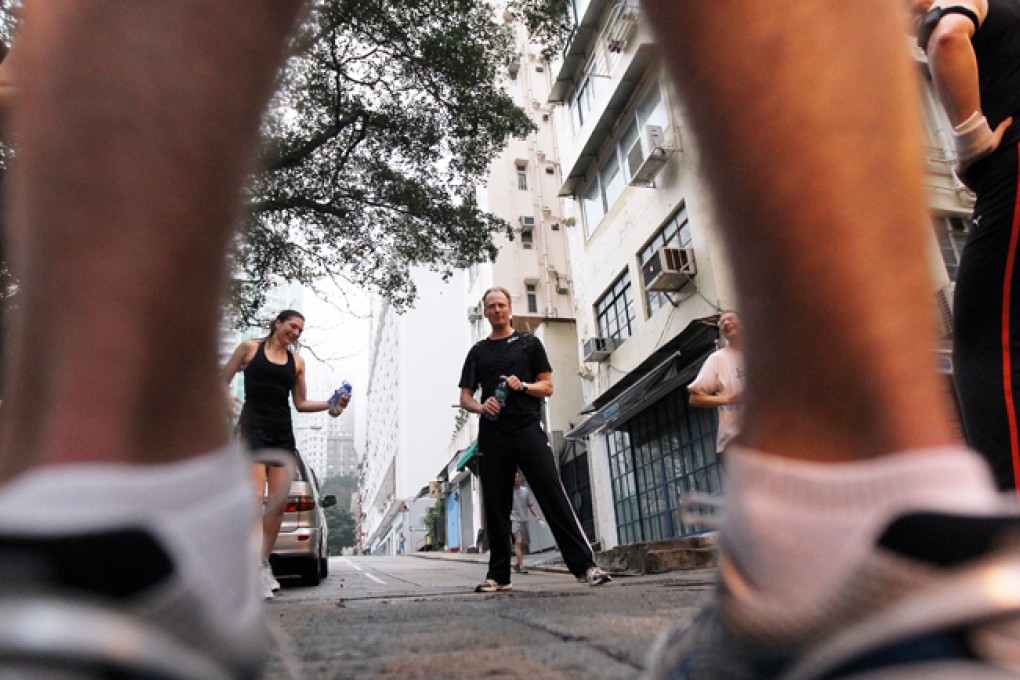 Geoff Hindmarsh leads bankers doing intense early morning circuit training in Central. They are drawn to the intensity of the workouts and their emphasis on quantifiable results. Photo: K.Y. Cheng