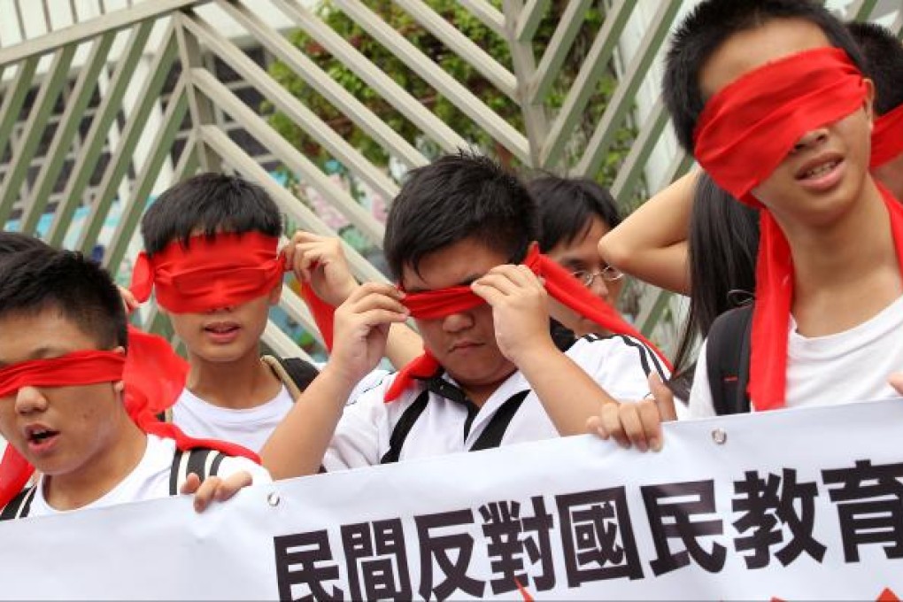 Concern group on national education takes 4 hours march from Tin Shui Wai to Yuen Long for the scrap of national education on August 26, 2012. SCMP