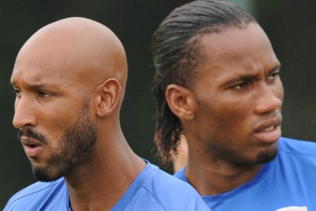 Nicolas Anelka (left) and Didier Drogba training in Shanghai - they are reported to be earning more than US$300,000 a week. Photo: AFP