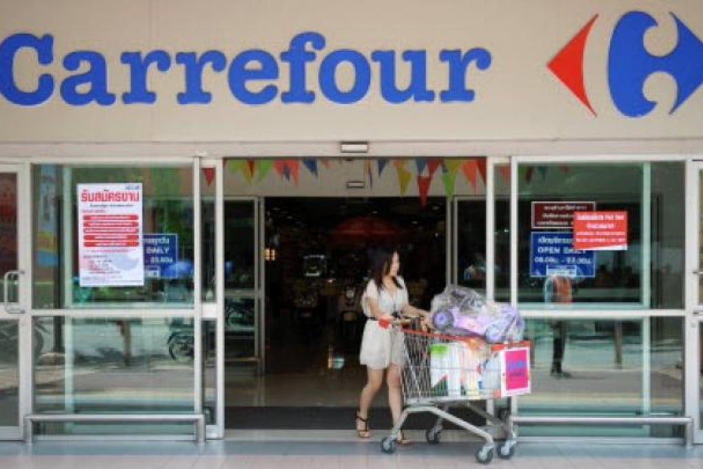 After aggressive expansion in Asia, the French retail giant last month reportedly put Indian expansion on ice, and is now planning to leave Singapore by the end of 2012. Photo: AFP
