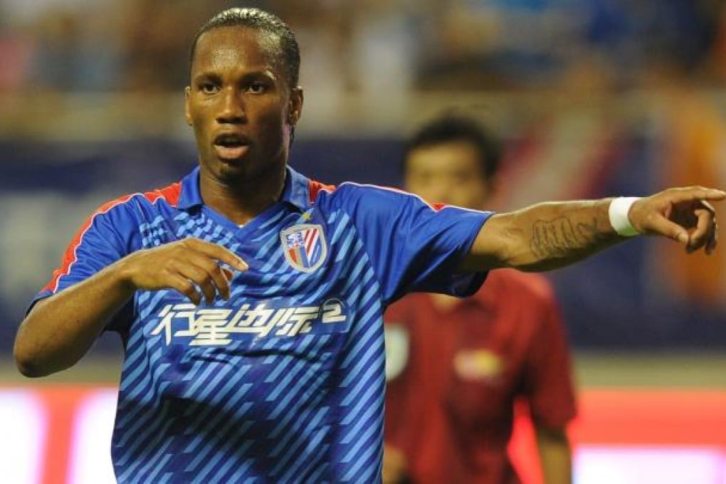 Didier Drogba plays for Shanghai Shenhua FC against Hangzhou Greentown in Hongkou Stadium, Shanghai. Photo: AFP