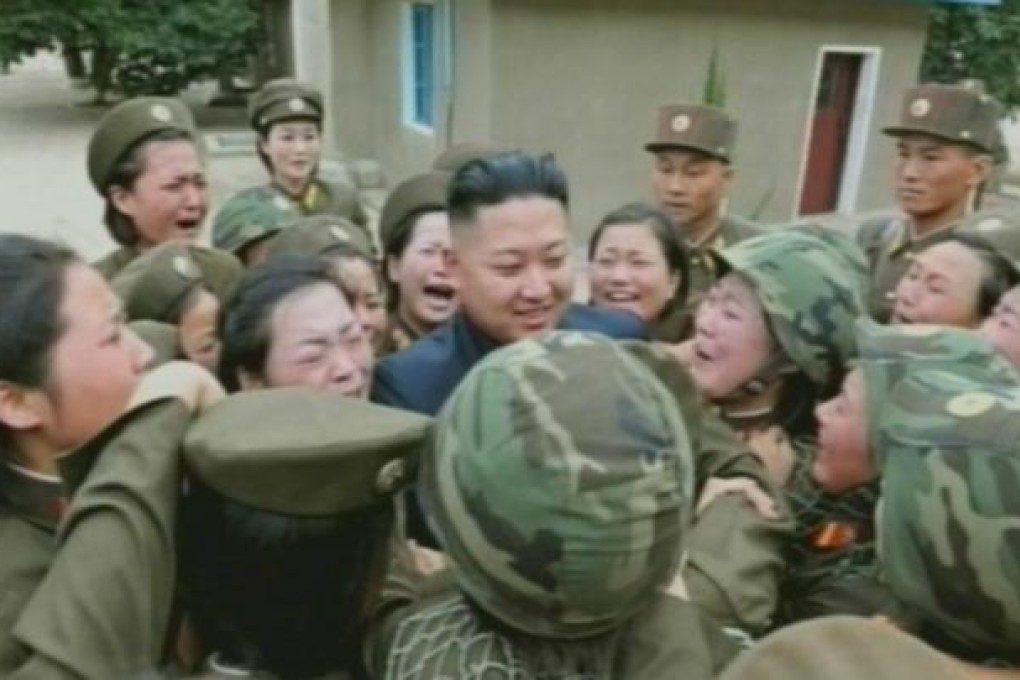 Kim Jong-un surrounded by female soldiers. Photo: EPA