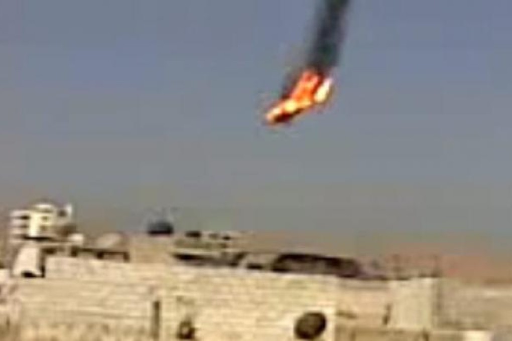 A helicopter is shot down near Damascus on Monday following clashes between the Syrian Army and the Free Syrian Army. Photo: EPA