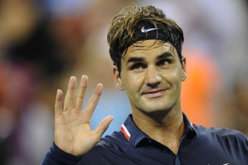 Switzerland's Roger Federer reacts after beating Donald Young in the first round of the US Open. Photo: AFP