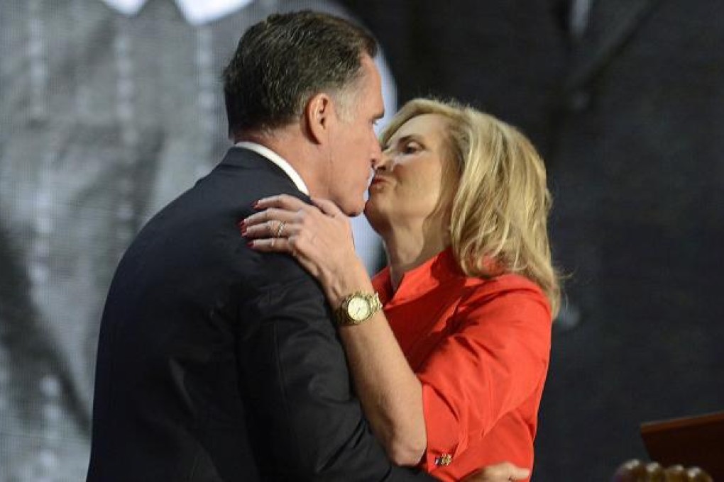 Republican nominee Mitt Romney kisses his wife at the party convention in Florida. Photo: MCT