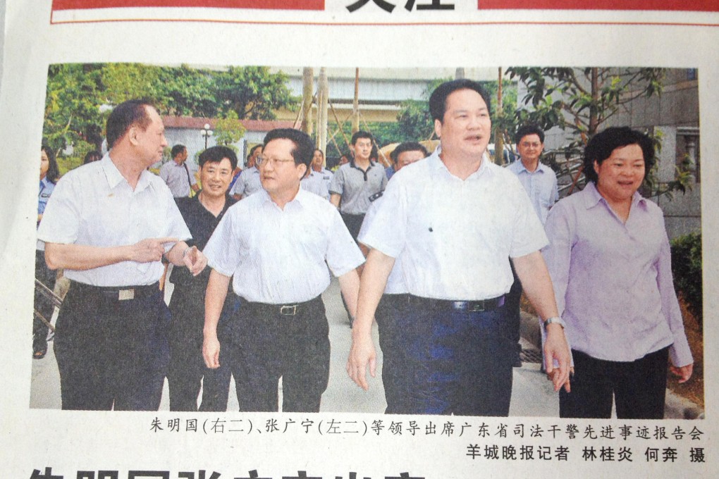 A picture taken from Yangcheng Evening News showing Zhang Guangning (second left) walking to a conference. Photo: SCMP