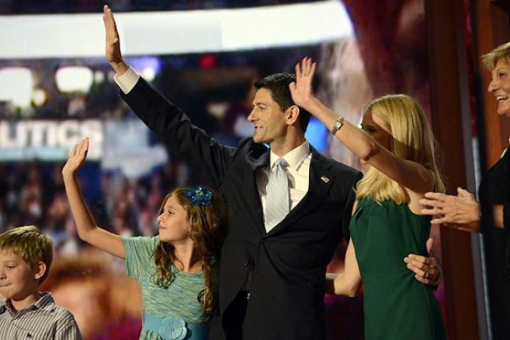 Republican vice presidential nominee Paul Ryan and his family wave at the end of Ryan's speech at the Tampa Bay Times Forum in Florida on Thursday. Photo: AFP