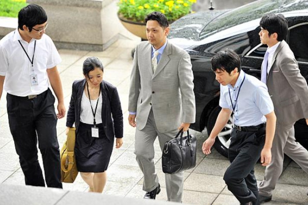 An official from the Japanese embassy in South Korea arrives at the Foreign Ministry in Seoul to receive a diplomatic document on Thursday. Photo: AFP