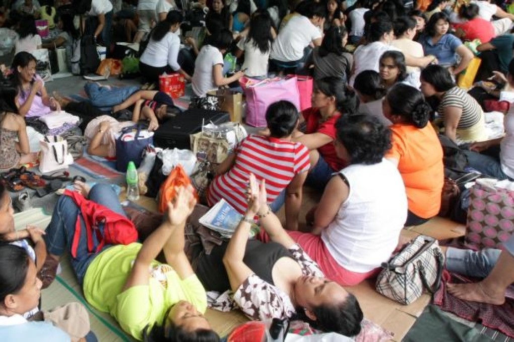 Domestic helpers gather in Central to enjoy their day off. Hong Kong may soon be faced with an acute shortage of maids. Photo: David Wong