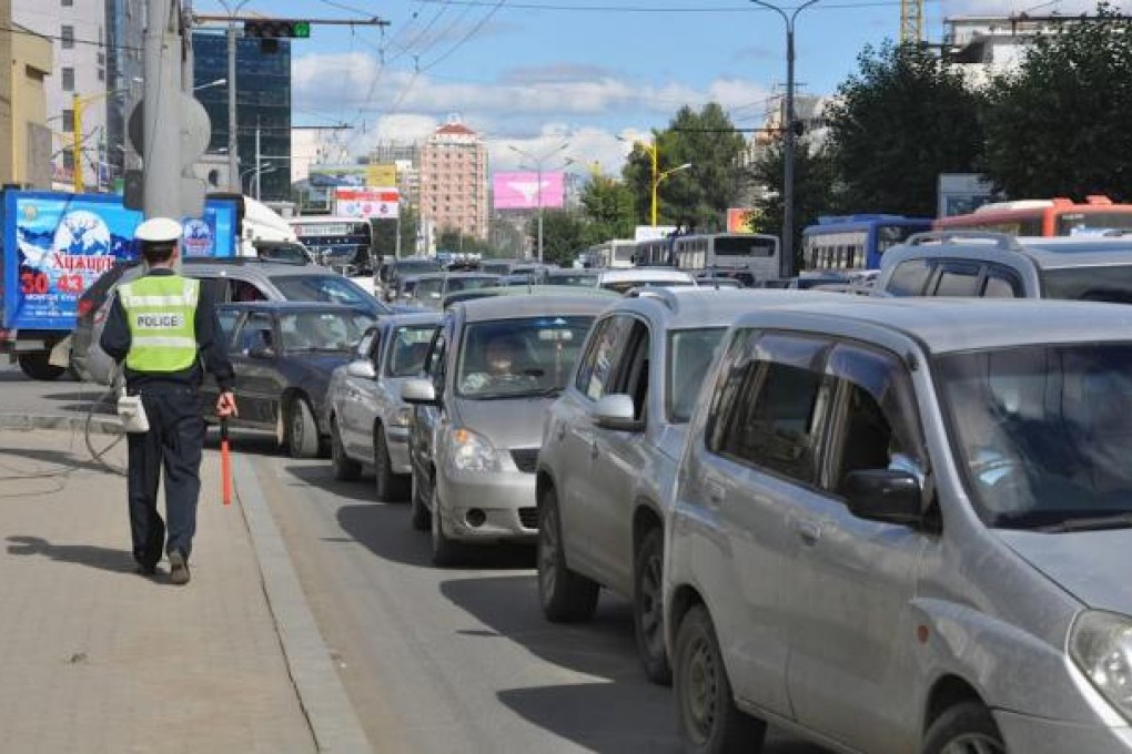 Affluent Mongolians, who import luxury vehicles, has contributed to the traffc problems in Ulan Bator.
