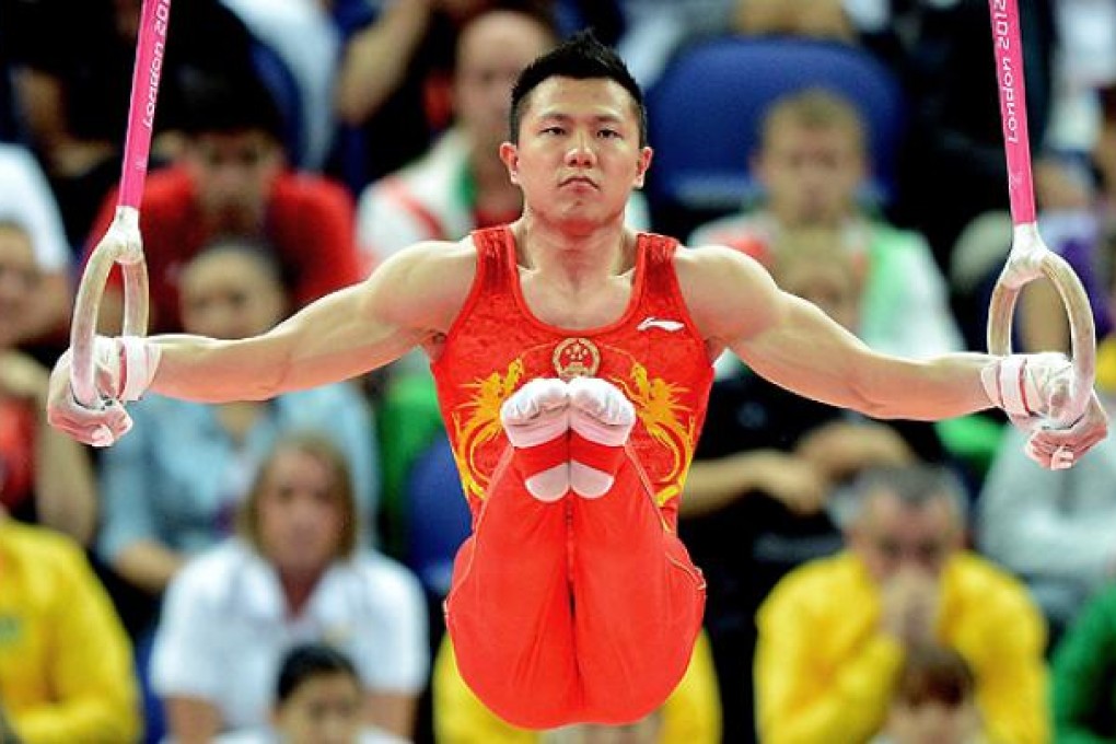 Yibing Chen competes in the men's rings final  at the London Olympics. Photo: EPA