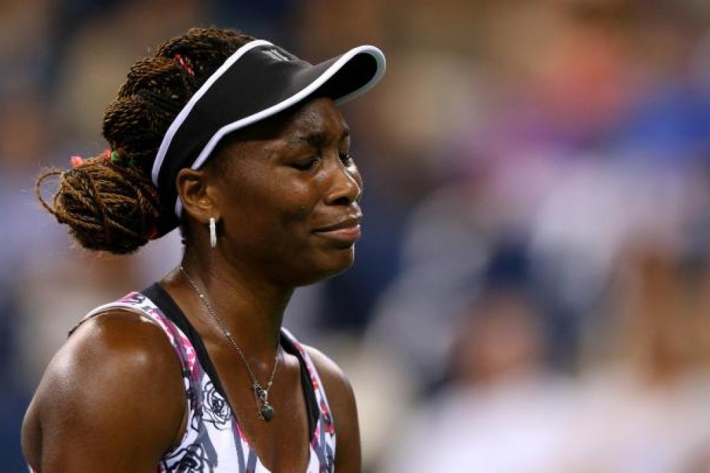 Venus Williams appears nearly in tears during her three-set loss to German Angelique Kerber in the second round of the US Open. Photo: AFP