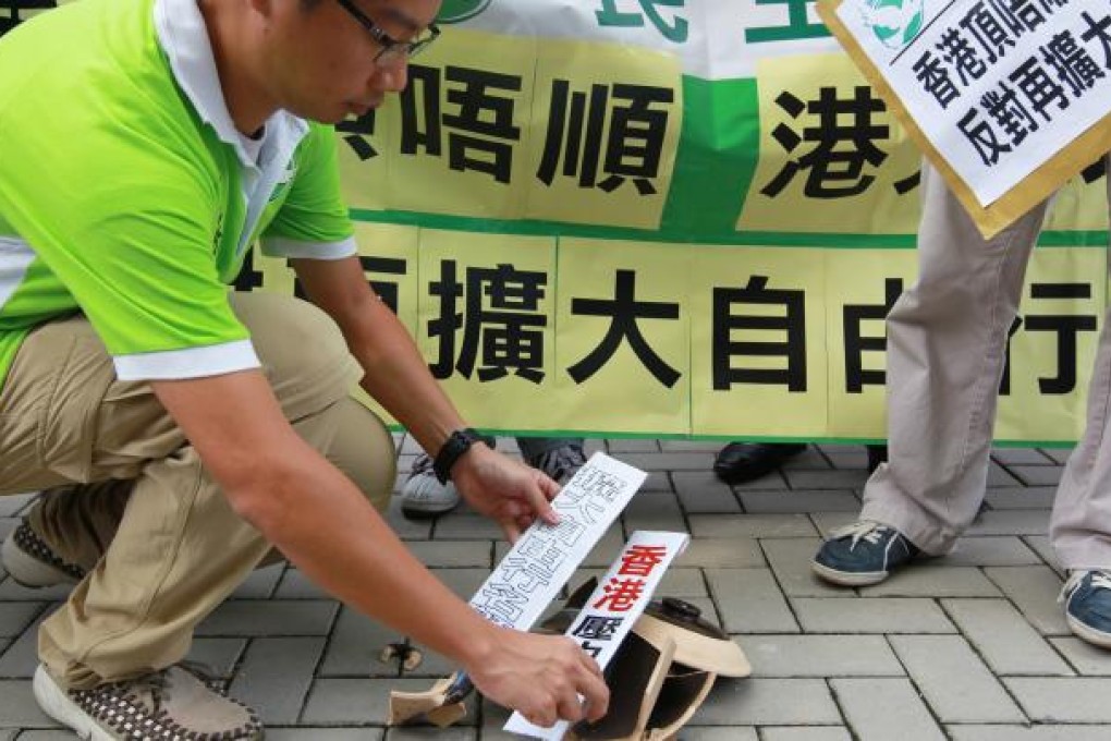 Democratic Party members protest outside the Central Government Office in Hong Kong on August 29. Photo: Dickson Lee