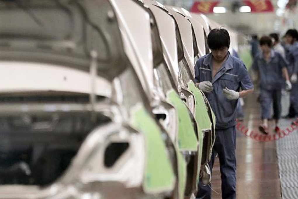 A worker assembles cars at a Geely factory in Cixi, Zhejiang province. Photo: AP