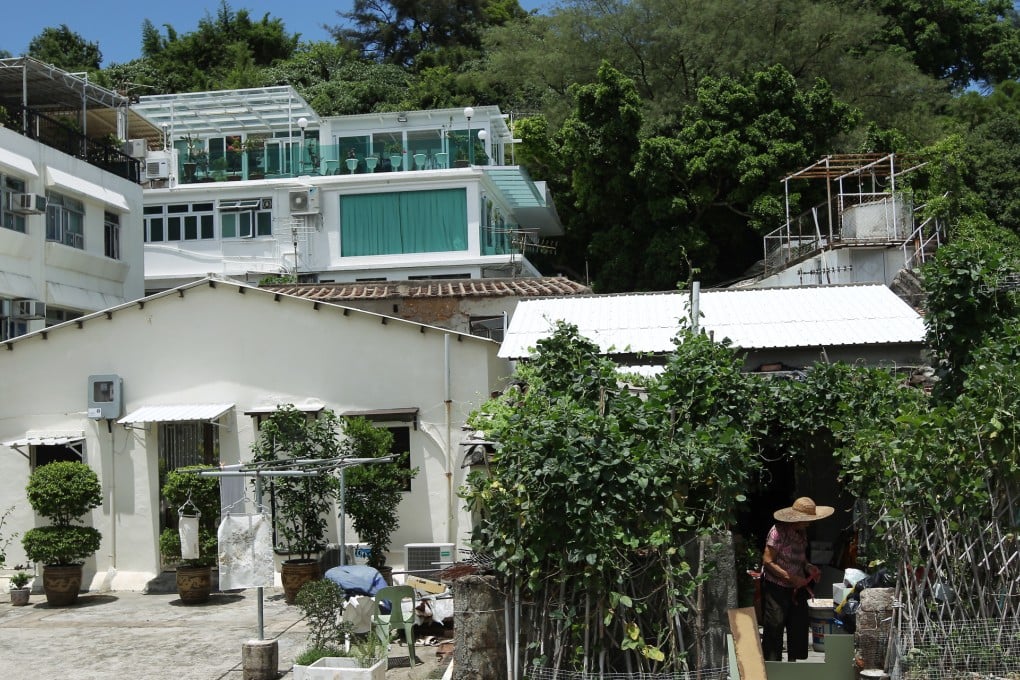 Old-style houses sit next to lavish, newly refurnished apartments on Peng Chau. Photo: David Wong