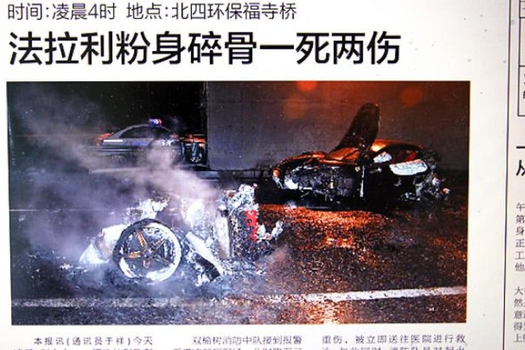 The Beijing Evening News report showing a speeding black Ferrari hitting a wall on Beijing's North Fourth Ring Road in the early hours of March 18, 2012.  Photo by Simon Song