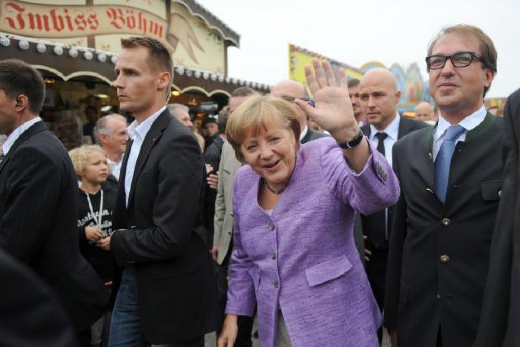 German Chancellor Angela Merkel arrives for the 'political morning pint' event at the Gillamoos fair in Abensberg, southern Germany. Photo: AFP