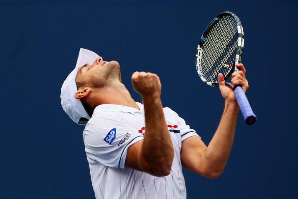 Andy Roddick celebrates a point against Fabio Fognini of Italy. Photo: AFP