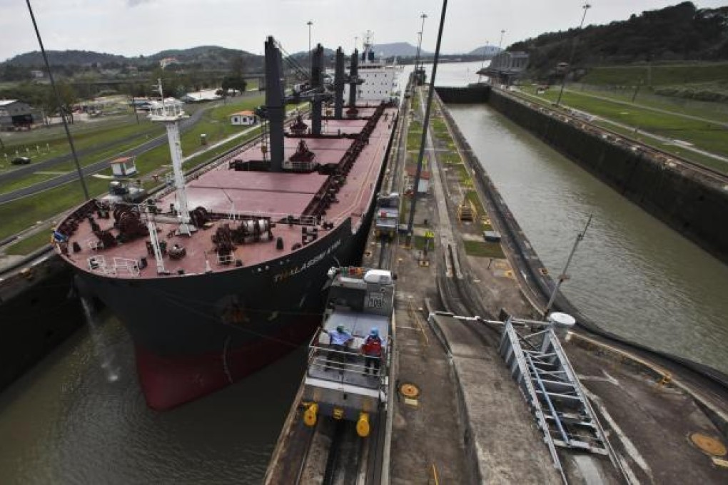 A ship makes its way through the Miraflores locks of the Panama Canal. The expansion is expected to double the amount of goods that can pass through it each year. Photo: NYT
