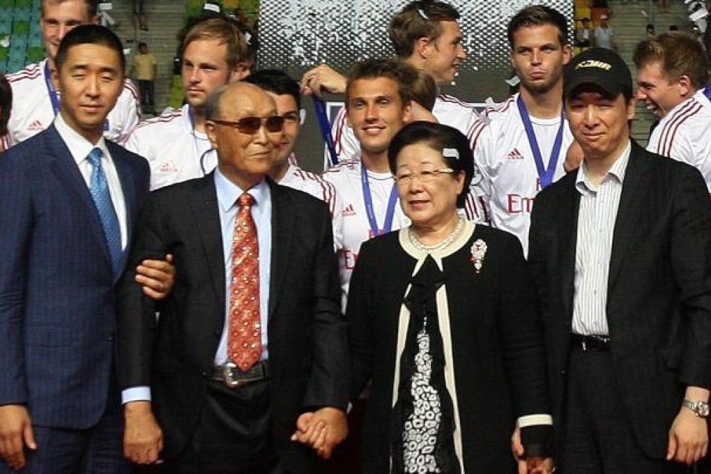 The Reverend Sun Myung Moon, the founder of the Unification Church, second from left, poses with his wife Hak Ja Han Moon, second from right, his sons Hyung-jin Moon, left, and Kook-jin Moon during the closing ceremony of the 2012 Peace Cup Suwon in July. Photo: AP