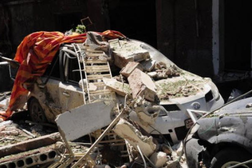 Destruction from the latest violence in Syria in the Damascus suburb of Jaramana on Monday. Photo: EPA