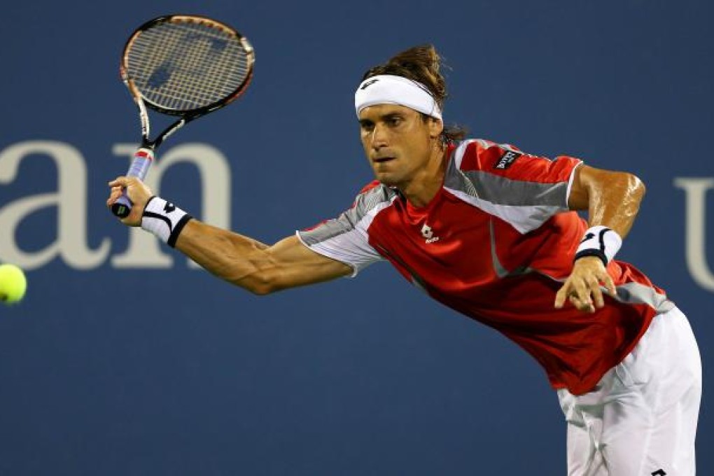 David Ferrer hits a shot against Richard Gasquet on Day 9 of the US Open in New York. Photo: AFP