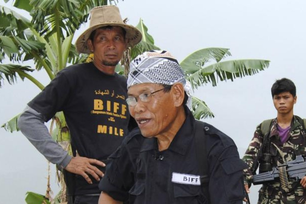 Ameril Umbra Kato (centre) the commander of Bangsamoro Islamic Freedom Fighters, the breakaway faction of the largest Filipino Muslim rebel group. Photo: AP