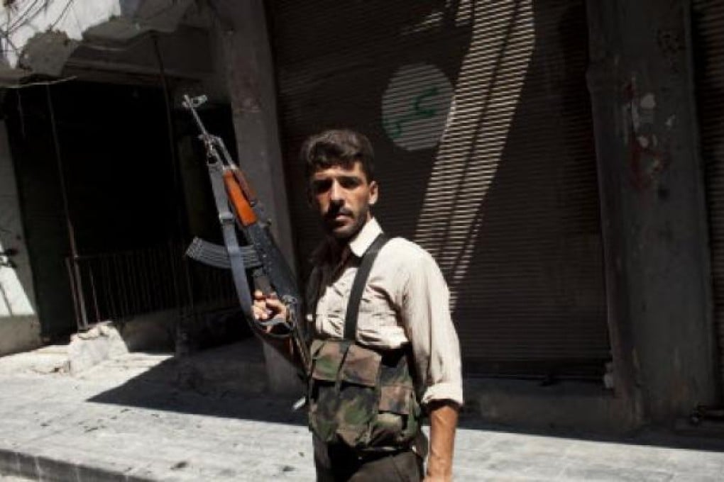 Syrian fighter with the Free Syria Army (FSA) is pictured in the old city of Aleppo on Wednesday. Photo: EPA