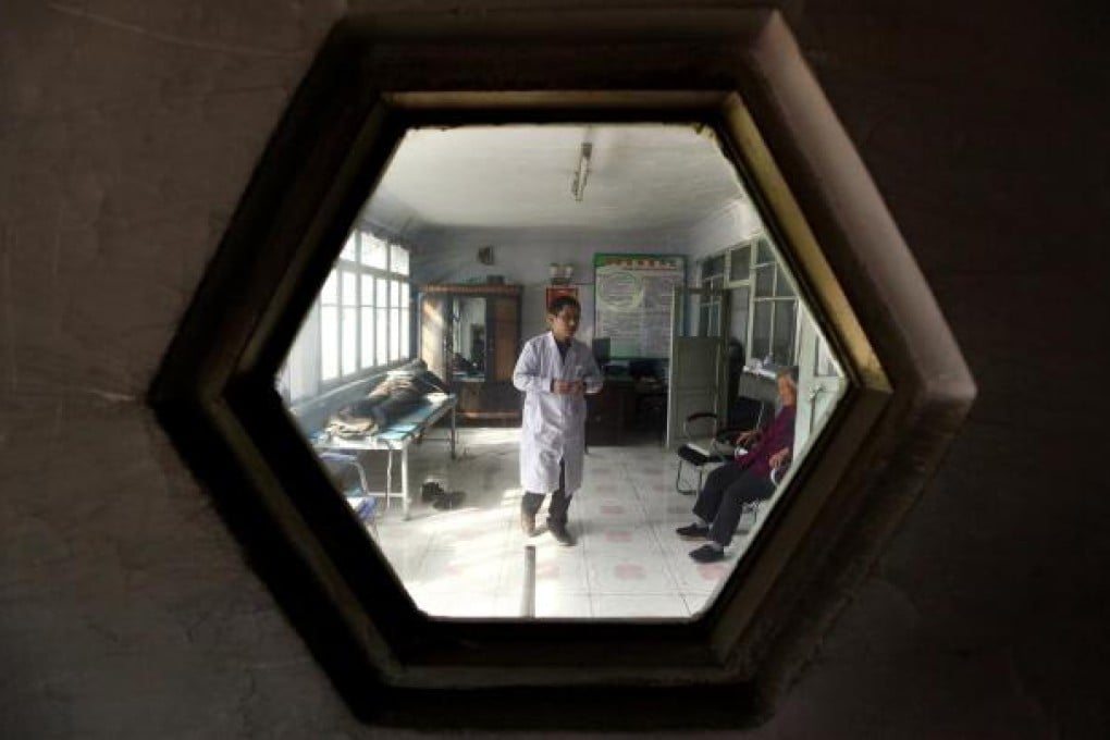 A doctor treats patients at a village clinic in Heilongjiang. TCL aims to make more affordable diagnostic imaging machines. Photo: Reuters