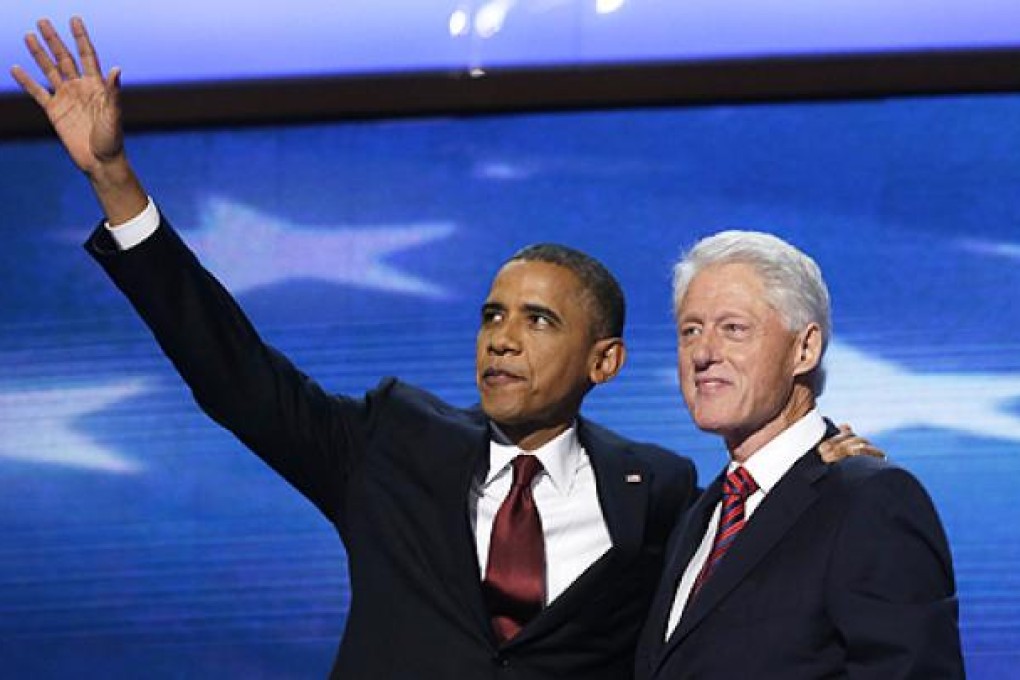 US President Barack Obama joins Bill Clinton on stage after the former president's rousing speech at the Democratic National Convention on Wednesday. Photo: AP