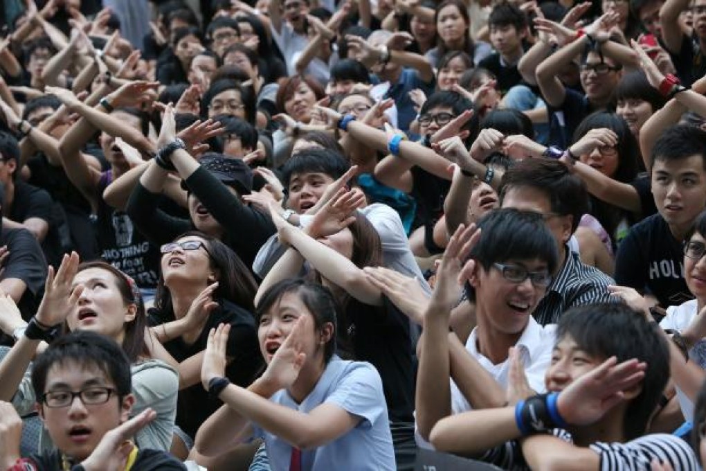 Students, teachers and parents gather outside Central Government Offices in Tamar to protest against national education. Photo: David Wong