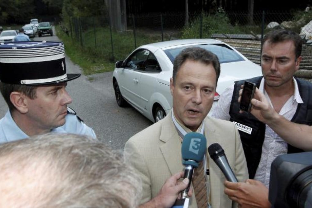 French prosecutor Eric Maillaud (centre) speaks to the media at the site where the bodies of four people in a British-registered car. Photo: EPA